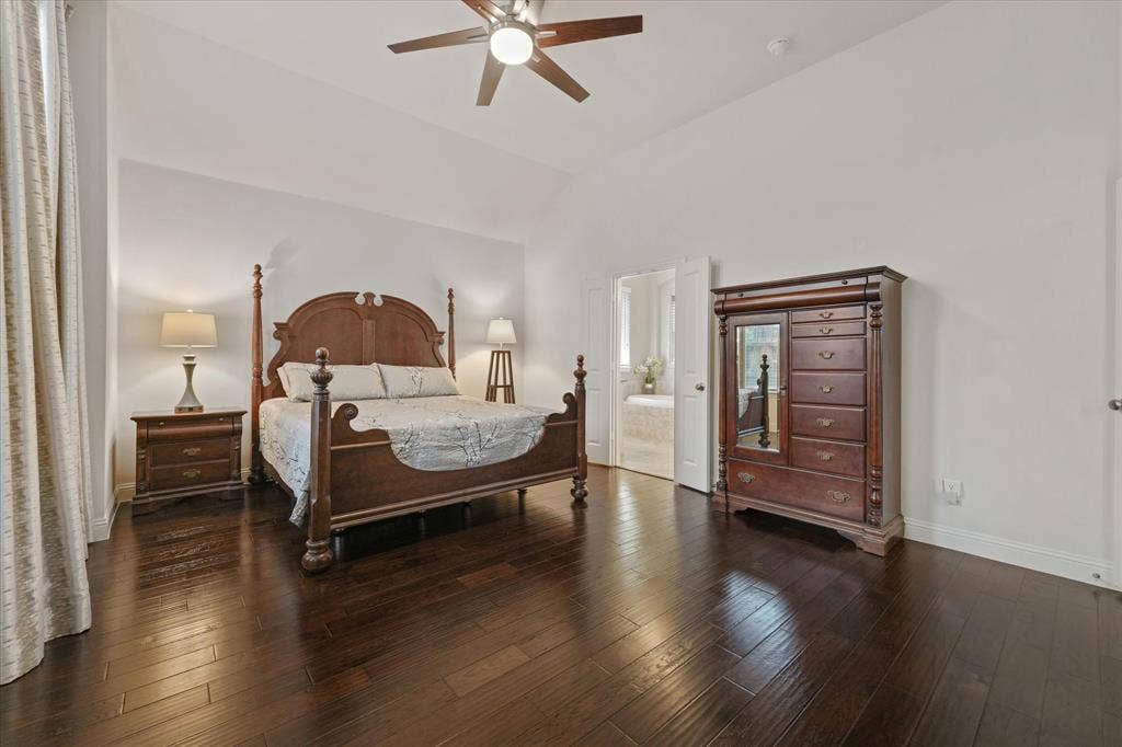 1113 5th Street, Argyle, TX 76226 Private primary bedroom with generous floor space, vaulted ceiling and a spacious layout designed to accommodate large furniture.