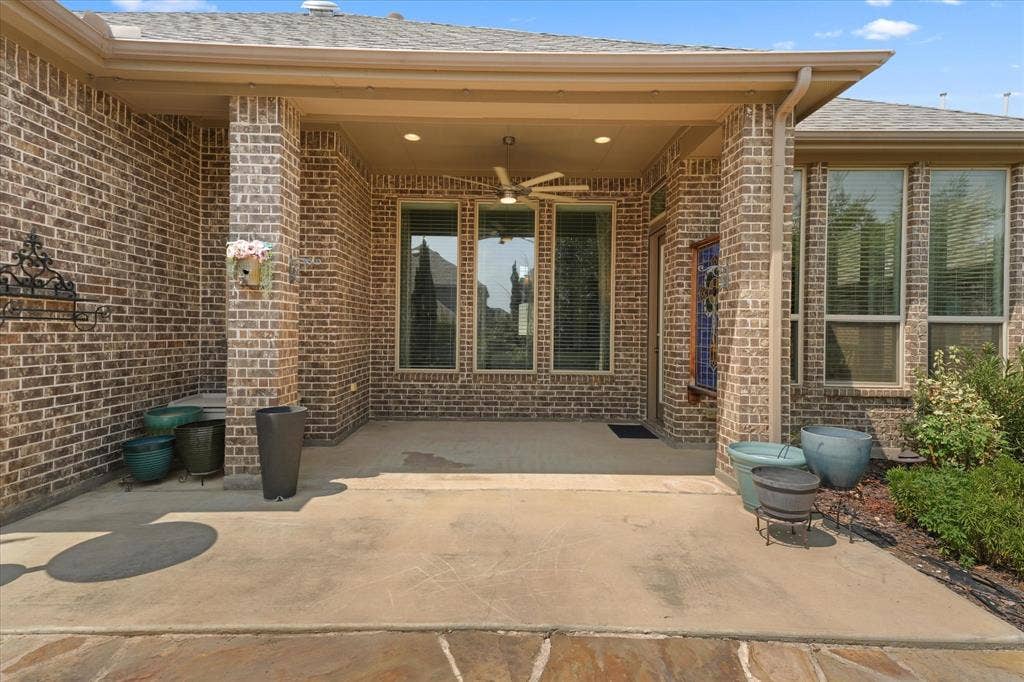 1113 5th Street, Argyle, TX 76226 Spacious covered patio with room for outdoor dining and seating, ideal for relaxing or entertaining year-round.
