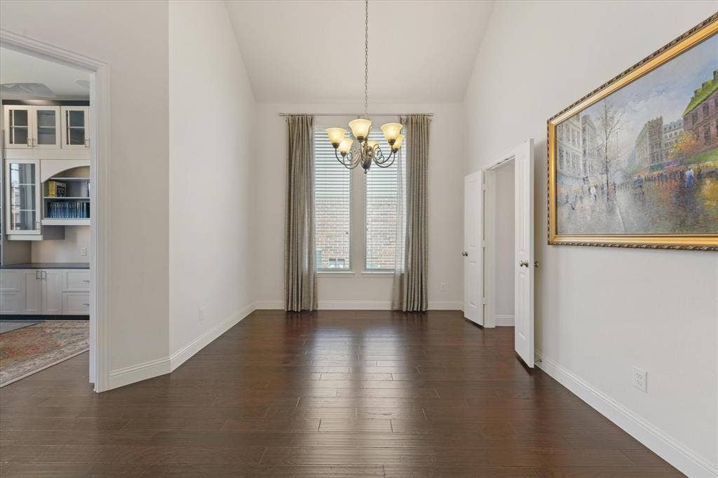 1113 5th Street, Argyle, TX 76226 Dedicated dining room with tall ceilings, hardwood floors and space for a large table, located next to the study and main living areas.