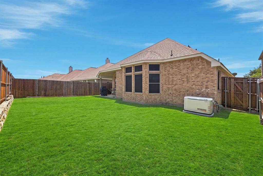 1556 Seminole Drive, Forney, TX 75126 Another view of the backyard and back of the home - generator comes with the home
