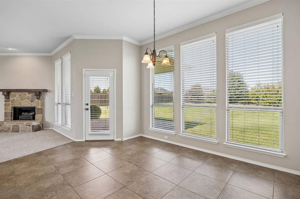 Start your mornings surrounded by natural light in the sunny breakfast nook overlooking the backyard, with easy access to the covered patio for indoor-outdoor living.