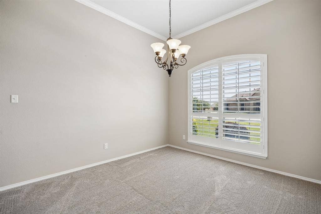 Host memorable dinners in the elegant formal dining room featuring plantation shutters, crown molding, and abundant natural light.