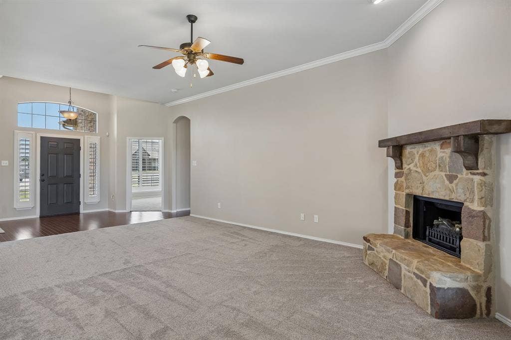 Enjoy the open-concept design where the spacious living room seamlessly connects to the kitchen and breakfast area, creating the perfect gathering place. The fireplace is wood burning but has an electric fire flame unit.