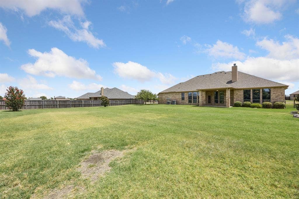 Oversized backyard provides exceptional space for outdoor activities, gardening, entertaining, or future additions while maintaining privacy and open views.