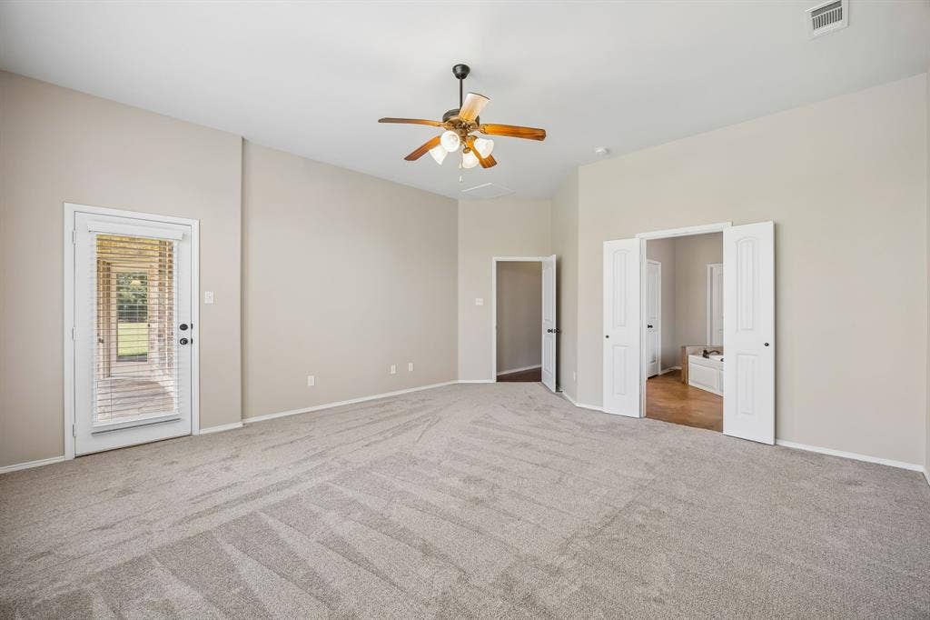 The expansive owner's retreat offers plenty of room for a sitting area while providing direct access to the luxurious ensuite bath.