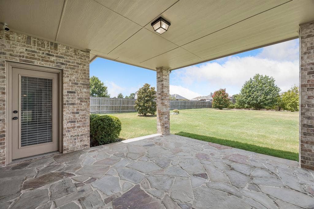 Enjoy peaceful outdoor living from the spacious covered patio overlooking the large, private backyard with plenty of room for a pool, play area, or future outdoor kitchen.