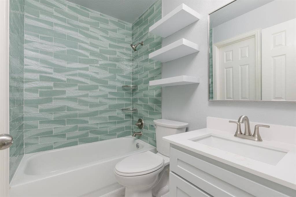 1913 Abilene Way, McKinney, TX 75072 Bathroom featuring a vanity with a white countertop and integrated sink