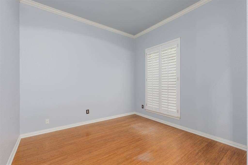 1913 Abilene Way, McKinney, TX 75072 Room featuring wood-finish flooring, plantation shutters, crown molding, and baseboards