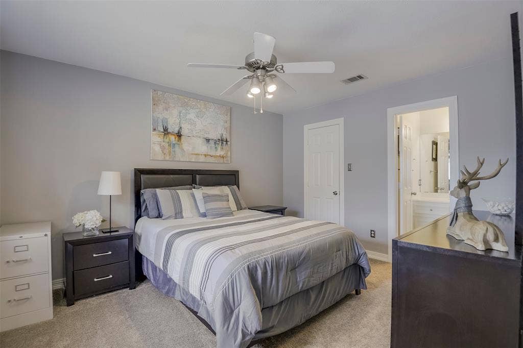 1200 Lakeway Drive, Plano, TX 75075 Secondary bedroom suite with walk-in closet, double vanity sinks and bathtub