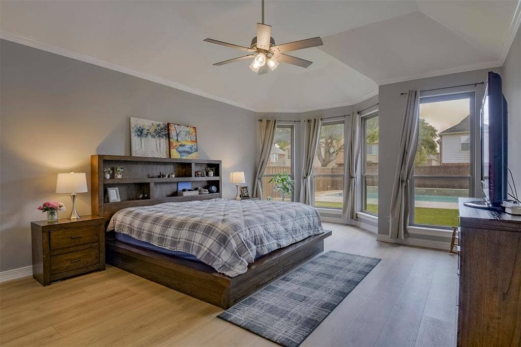 1200 Lakeway Drive, Plano, TX 75075 Hard-surface flooring, high ceilings, ceiling fan with light fixture, bay window, and crown molding