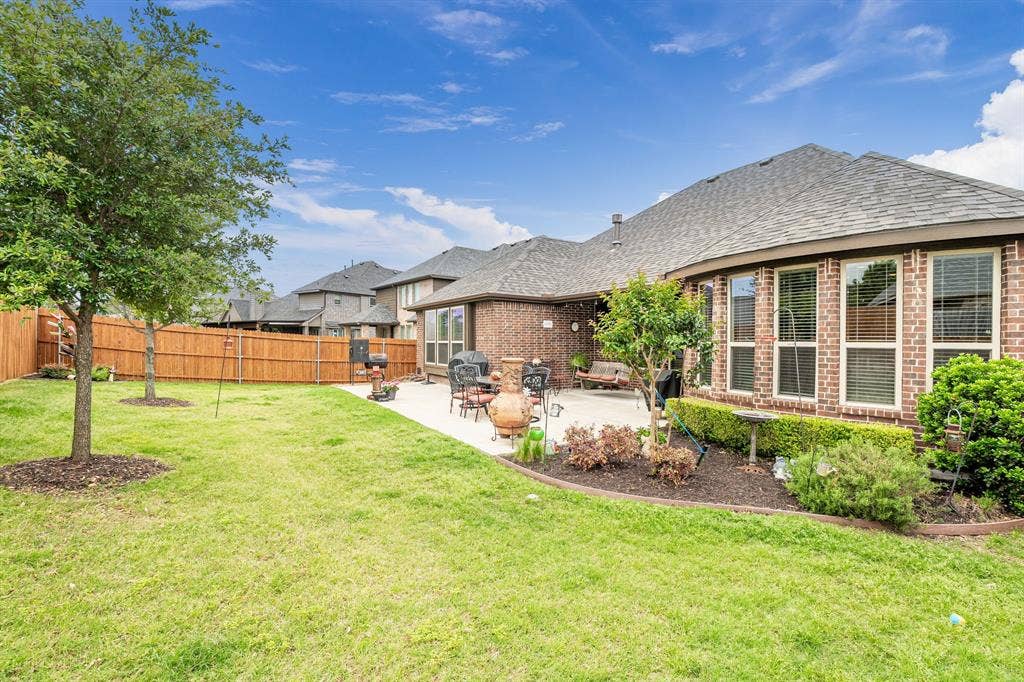 Covered porch with extended patio. Great for entertaining or relaxing with a cup of coffee.