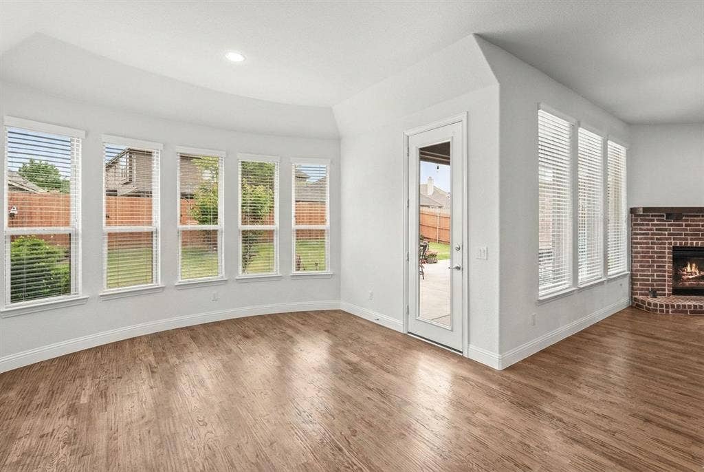 Spacious dining room with bay windows.