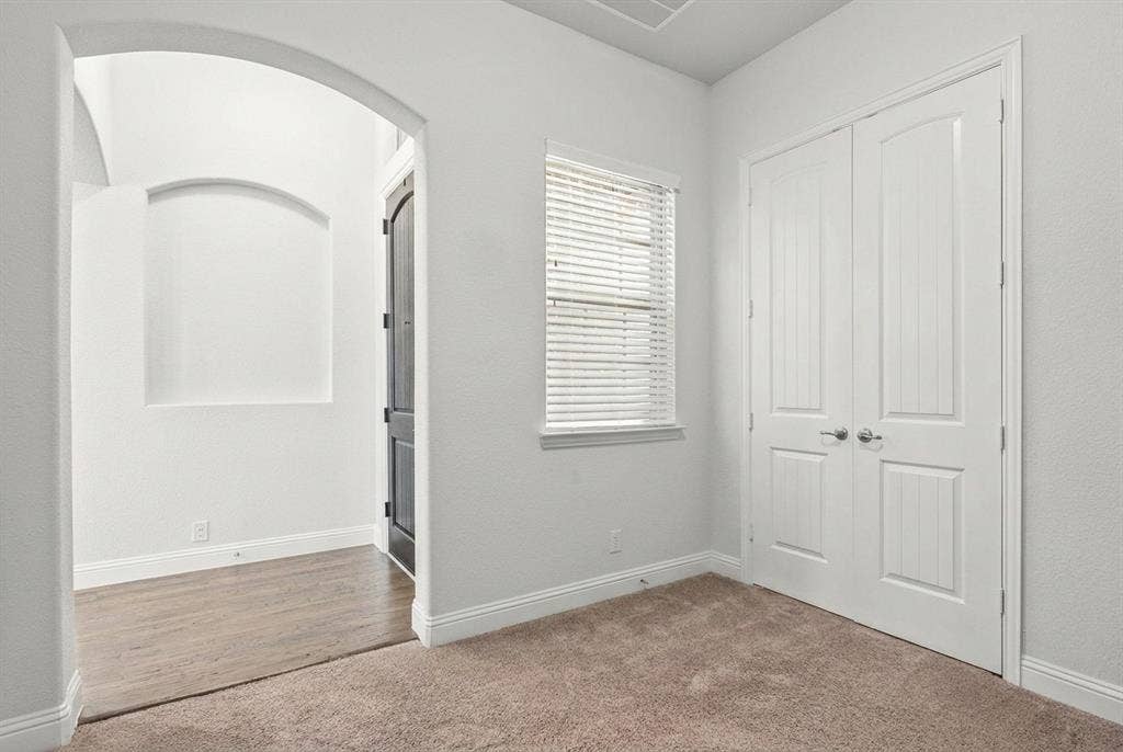 Office or flex space near the entrance of the home. Note the closet.