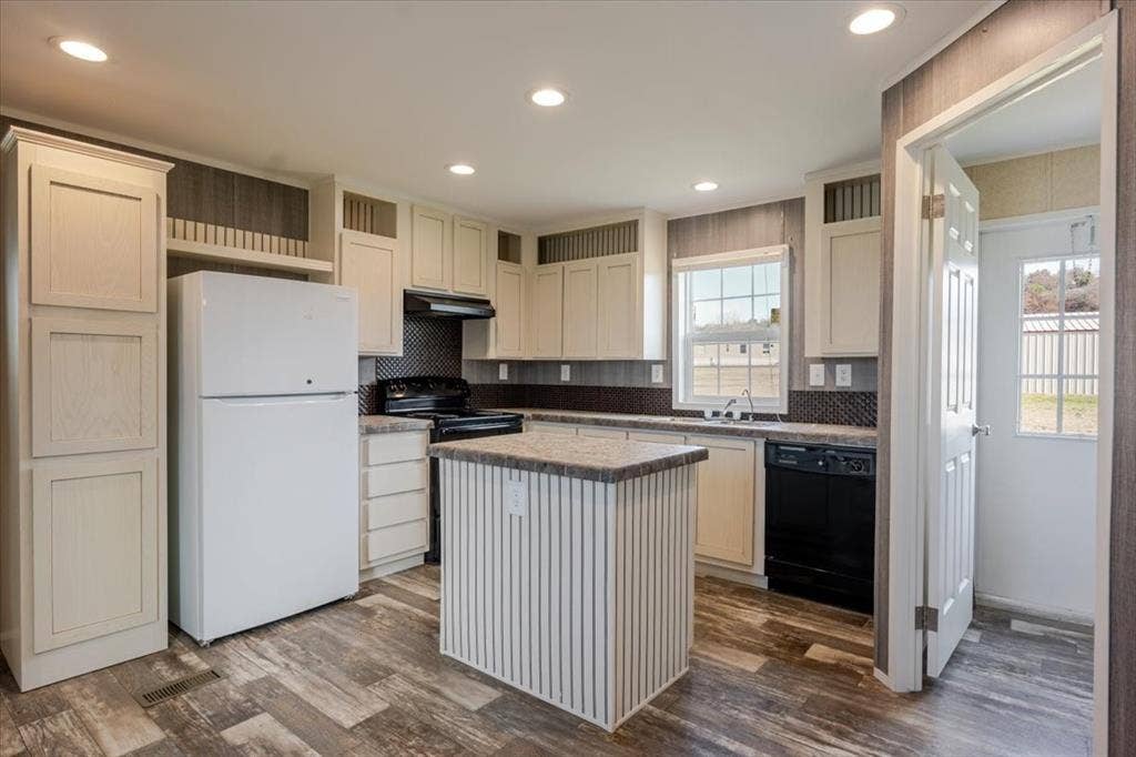 126 Starry Sky Court, Springtown, TX 76082 Kitchen featuring wood-finish flooring, recessed lighting, and a center island with a stone-look countertop. Refrigerator does not convey.