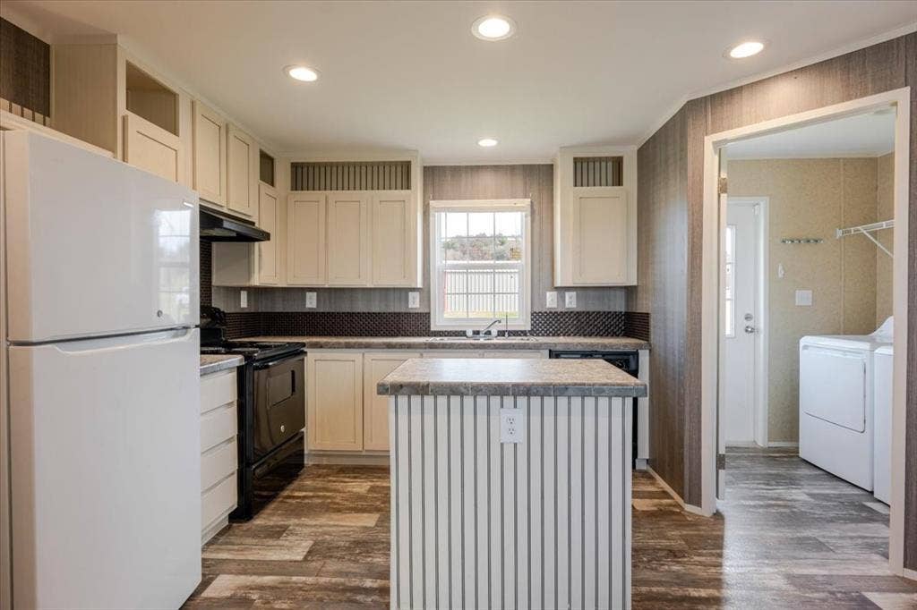 126 Starry Sky Court, Springtown, TX 76082 Kitchen featuring wood-finish flooring, recessed lighting, cream-colored cabinetry, a dark tile backsplash, and a central island with a granite-look countertop