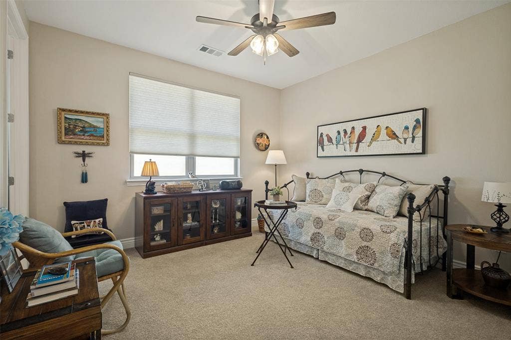 A WONDERFUL SPACE FOR GUESTS WITH ENSUITE BATH. CEILING FAN AND CUSTOM SHADES TOO.