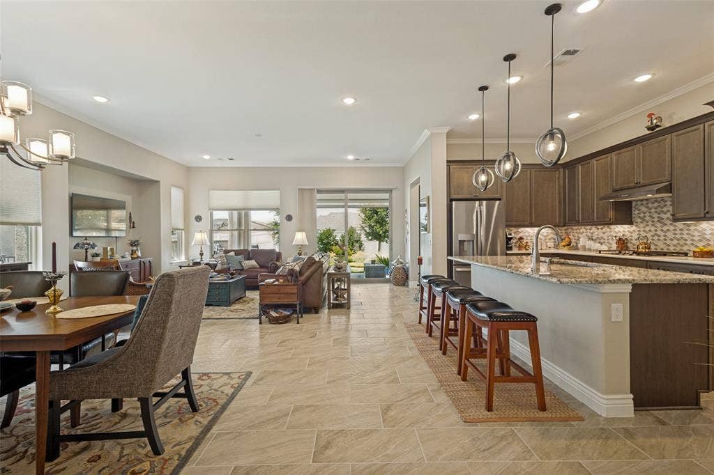 A GREAT VIEW OF THIS LARGE OPEN FLOOR PLAN FILLED WITH NATURAL LIGHT.