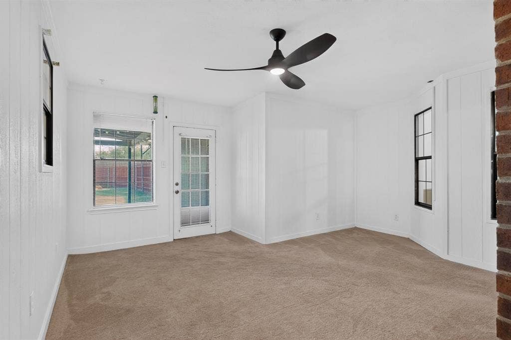 303 Stoneybrook Drive, Wylie, TX 75098 Neutral carpet flooring with white vertical paneling