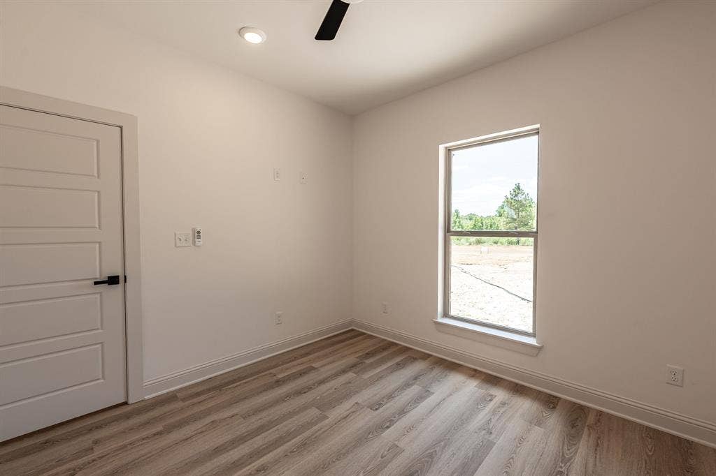 17049 Island Lake Drive, Tyler, TX 75708 Recessed ceiling lighting, a modern ceiling fan, and wood-finish flooring
