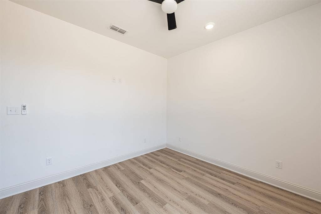 17049 Island Lake Drive, Tyler, TX 75708 Wood-finish flooring, recessed ceiling lighting, and a ceiling fan with light fixture