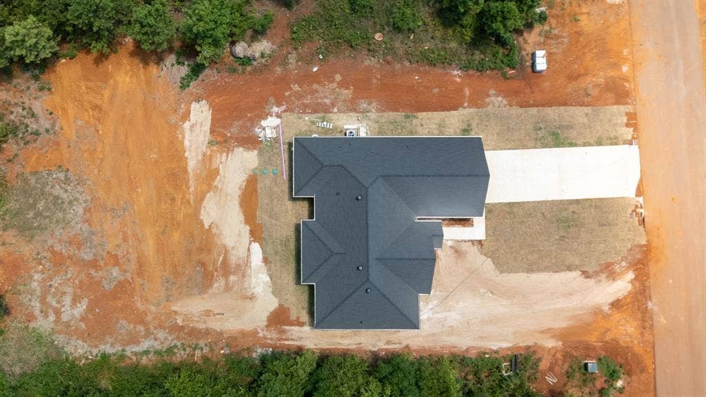 17049 Island Lake Drive, Tyler, TX 75708 New construction residence featuring a dark shingle roof and a concrete driveway