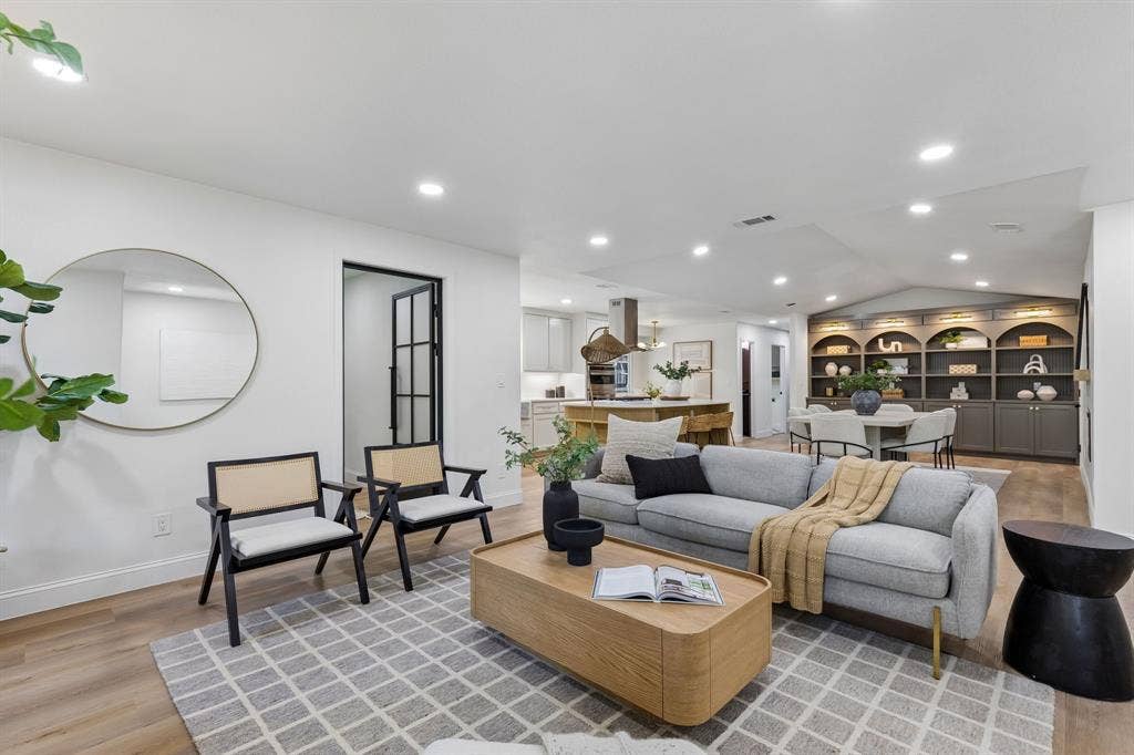 12124 Dixfield Drive, Dallas, TX 75218 Wood-finish flooring, recessed lighting, and a built-in shelving unit with integrated lighting