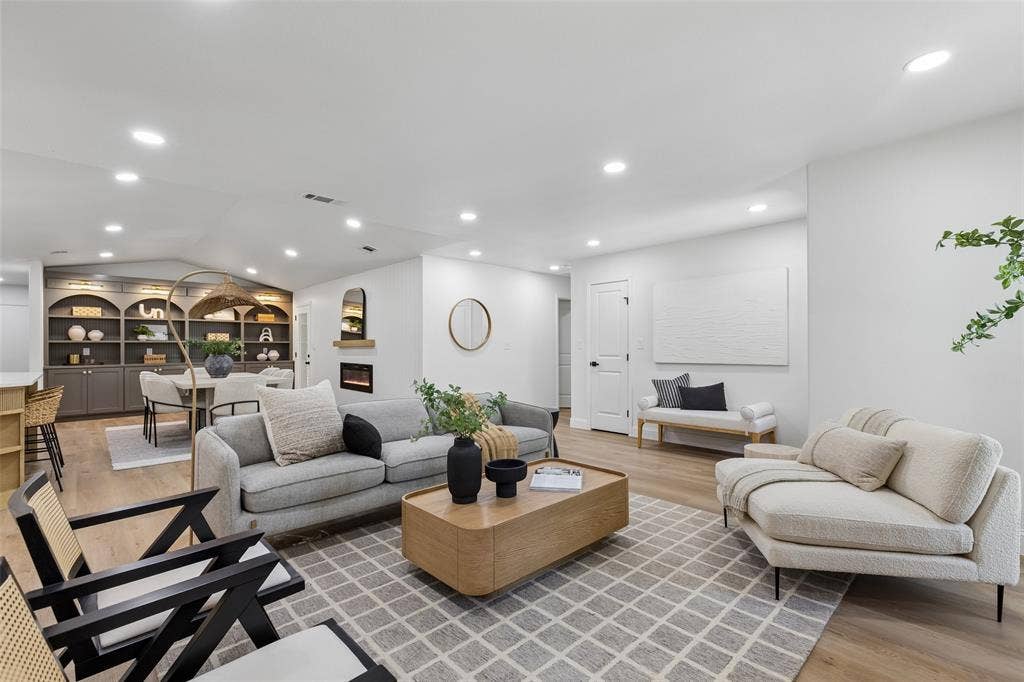 12124 Dixfield Drive, Dallas, TX 75218 Recessed lighting throughout, wood-finish flooring, built-in shelving, and a modern fireplace