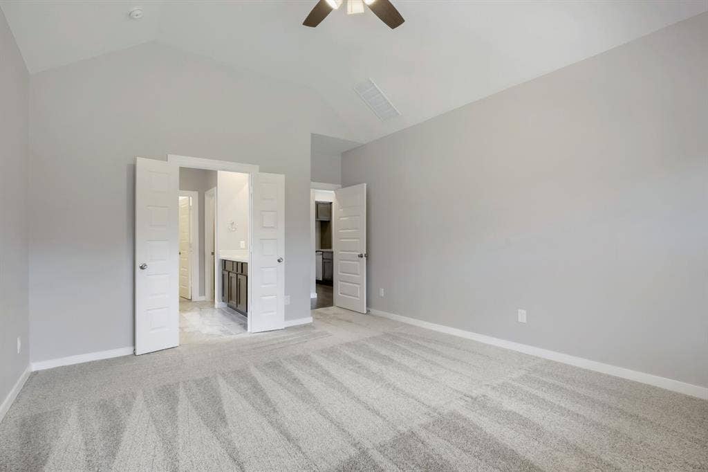 3925 Chesapeake Lane, Heartland, TX 75126 Vaulted ceilings, neutral wall tones, and installed ceiling fan with light fixture