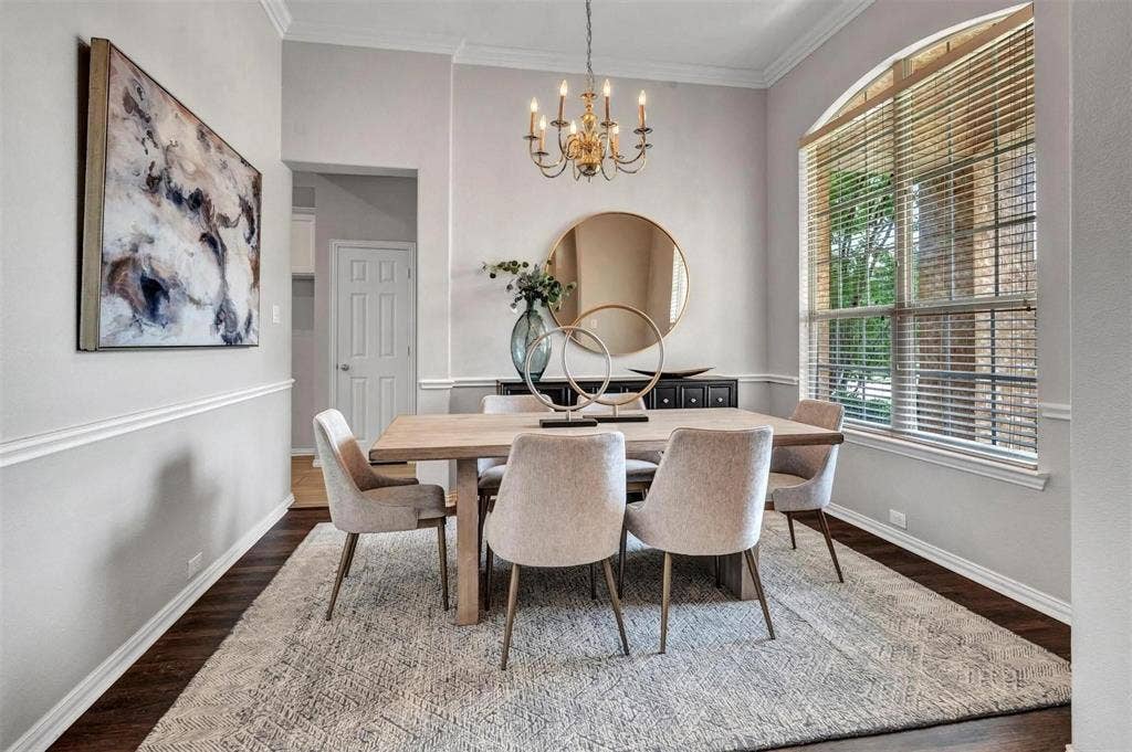 1601 Long Prairie Court, Allen, TX 75002 Dark wood-finish flooring with crisp white baseboards and chair rail molding