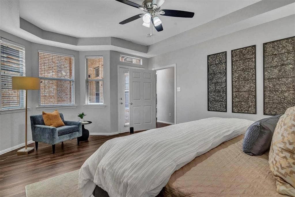 1601 Long Prairie Court, Allen, TX 75002 Tray ceiling, wood-finish flooring, ceiling fan with integrated lighting, double entry door, multiple windows with blinds
