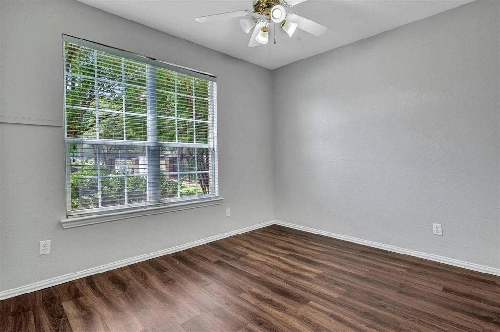 1601 Long Prairie Court, Allen, TX 75002 Wood-finish flooring, ceiling fan with integrated lighting, window with blinds, and light gray wall finish