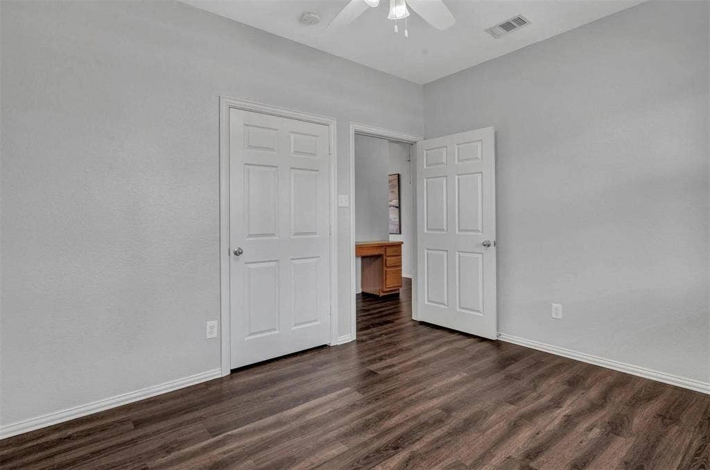 1601 Long Prairie Court, Allen, TX 75002 Wood-finish flooring with light gray walls, white trim, and a ceiling fan
