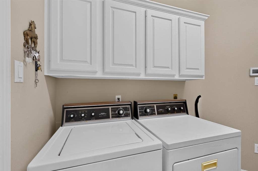 3820 Nash Lane, Plano, TX 75025 Built-in white cabinetry with crown molding, complemented by neutral wall tones