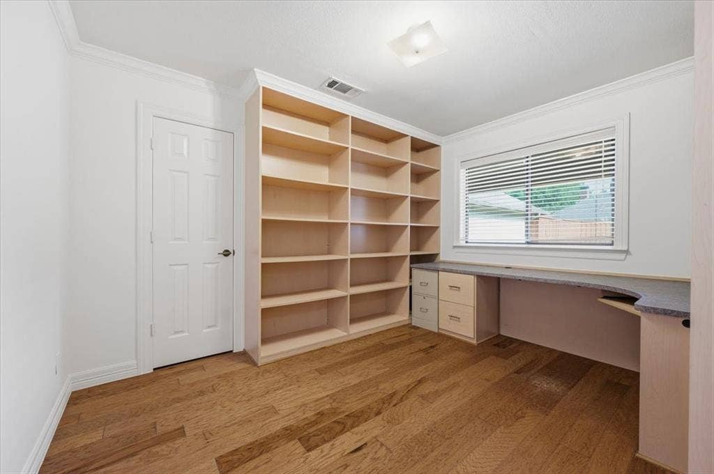 2669 Daffodil Drive, Richardson, TX 75082 Bedroom/ office. This room has a built-in office furniture.