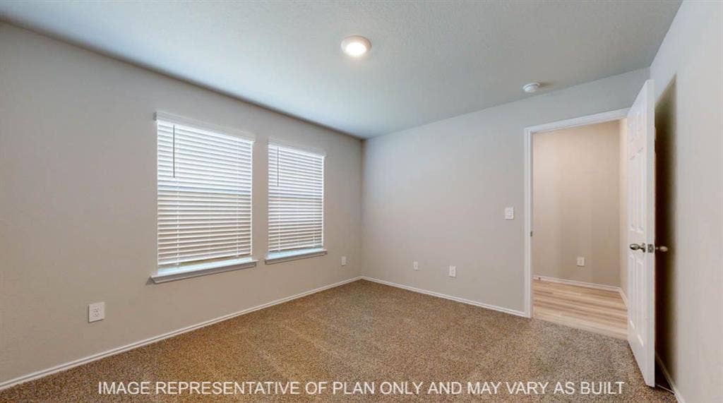 3016 Cyprian Road, Lorena, TX 76655 Bright secondary bedroom with dual windows featuring plantation shutters, wood-finish flooring, neutral paint finishes, recessed ceiling lighting, and direct hallway access