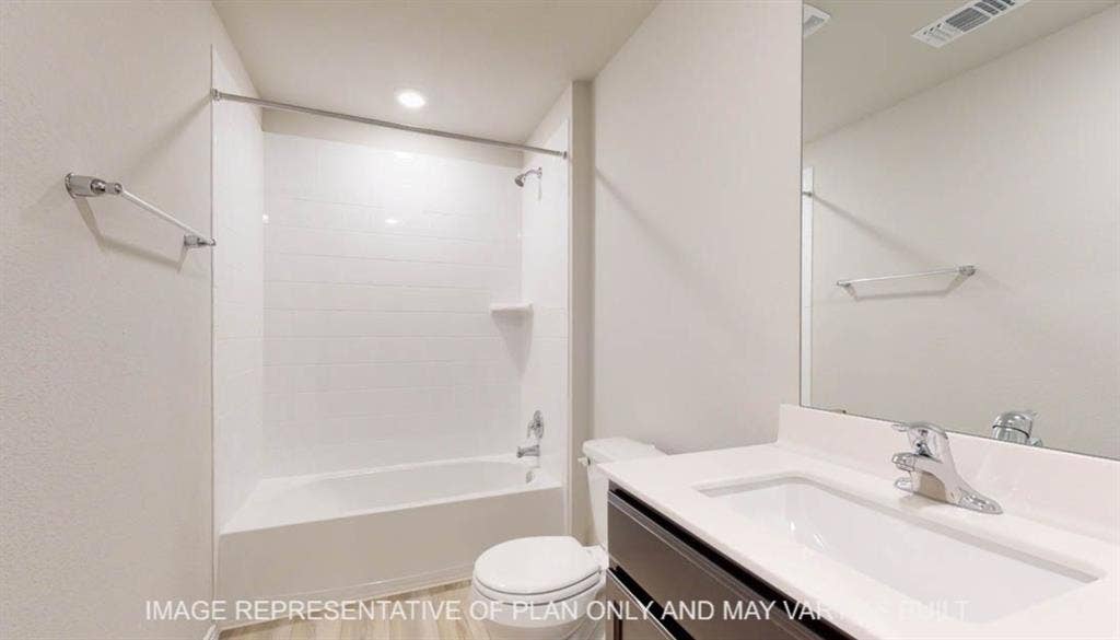 3016 Cyprian Road, Lorena, TX 76655 Tub/shower combination with white subway tile surround, dark wood-finish vanity with white countertop, integrated rectangular sink, and wall-mounted mirror