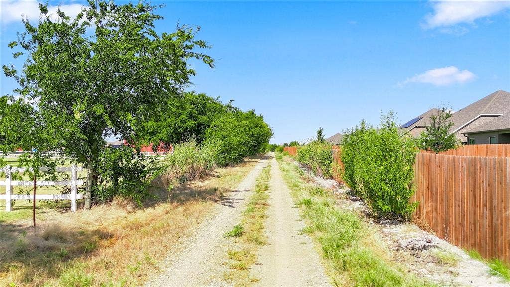 2109 Draco Drive, Haslet, TX 76052 This rarely used road backs to the home allowing for no actual backyard neighbors.