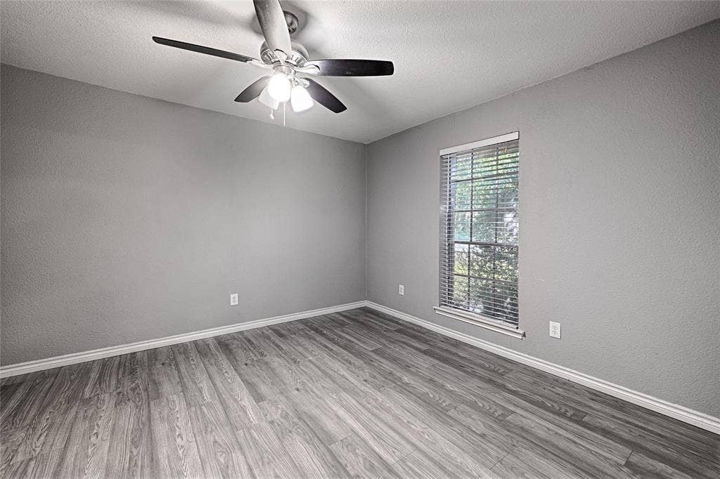 1223 Sequoia Drive, DeSoto, TX 75115 Wood-finish flooring, single window with blinds, ceiling fan with integrated lighting, and neutral wall tones