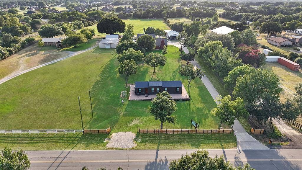 Expansive green lawn with mature trees