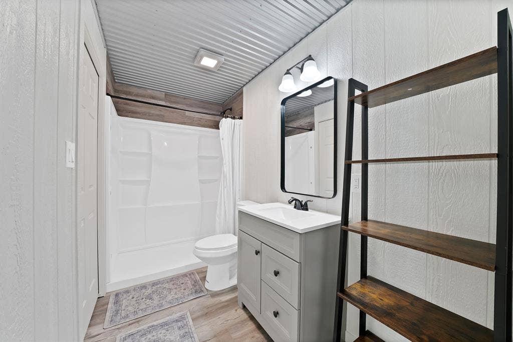 Corrugated metal ceiling with recessed lighting