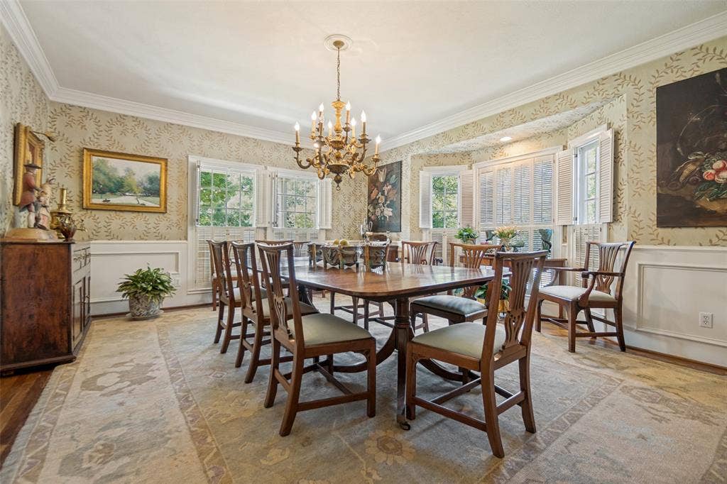 3418 Dartmouth Avenue, Highland Park, TX 75205 Crown molding, chandelier lighting, wainscoting, bay window, and hardwood flooring
