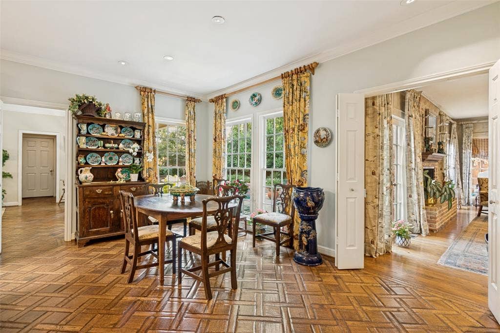 3418 Dartmouth Avenue, Highland Park, TX 75205 Wood-finish parquet flooring, multiple windows, double doors, recessed lighting, and a wide cased opening