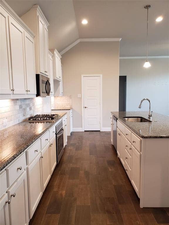 940 Parkside Drive, Argyle, TX 76226 Kitchen with white cabinetry, dark granite countertops, tile backsplash, and wood-finish flooring
