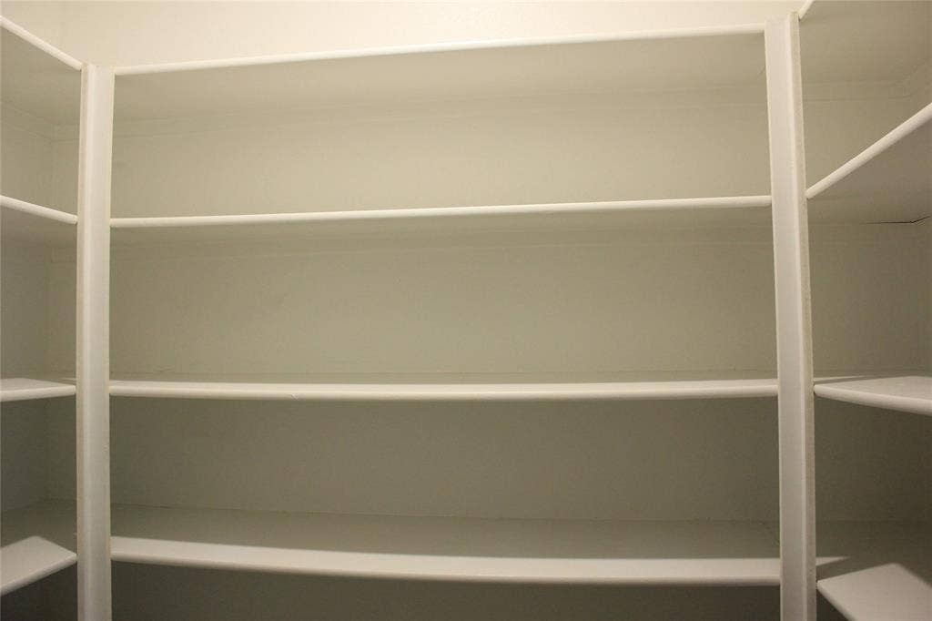 940 Parkside Drive, Argyle, TX 76226 Built-in shelving with multiple levels and white finishes