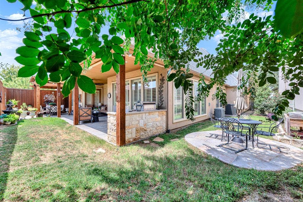 7032 PORTOBELLO Drive, Plano, TX 75024 Rustic wooden support beams frame seamless transitions between open sky and sheltered outdoor living spaces. Picture grilling up a summer feast while loved ones relax nearby under leafy canopies.