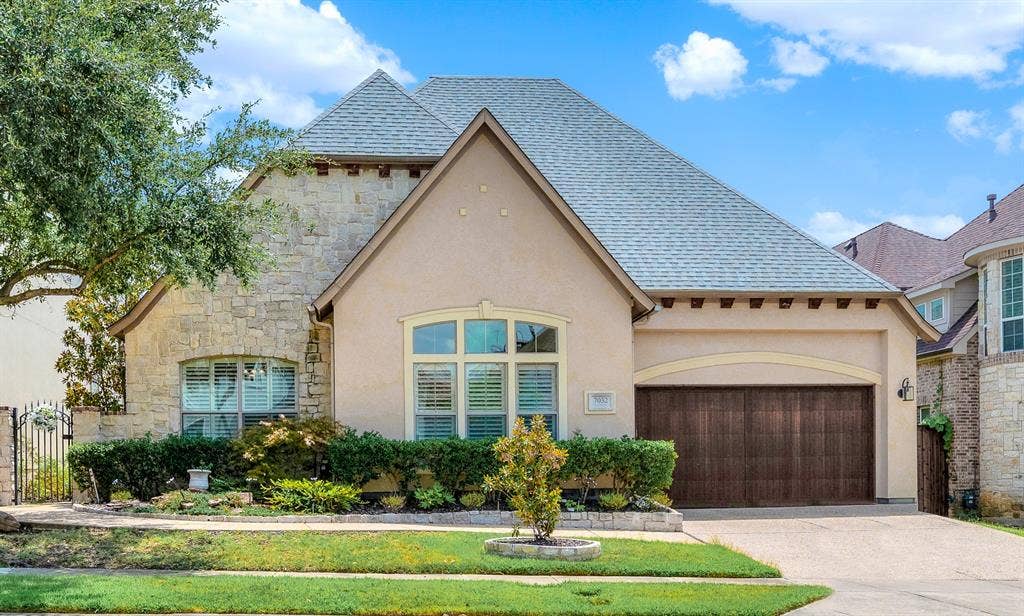 7032 PORTOBELLO Drive, Plano, TX 75024 Welcome Home to 7032 Portobello Drive a single-story French luxury! Warm stucco and stone accents and grand rooflines create an instantly welcoming façade bathed in soft daylight. Imagine returning home after a busy afternoon, feeling an immediate sense of quiet comfort as you pull into the driveway.