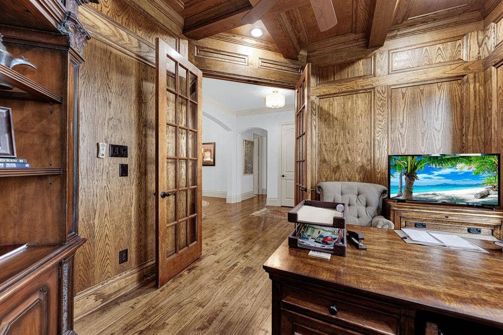 7032 PORTOBELLO Drive, Plano, TX 75024 Divided-lite glass double doors offer privacy while maintaining an open visual connection to the main living areas. Close the entry during important calls, creating a quiet sanctuary for uninterrupted concentration throughout the day.