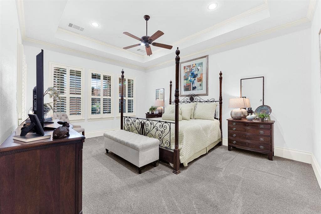 7032 PORTOBELLO Drive, Plano, TX 75024 A multi-tiered tray ceiling lifts the eye, while wide window shutters softly temper incoming daylight across plush carpeting. Drift off effortlessly at night in this peaceful, private sleeping quarters