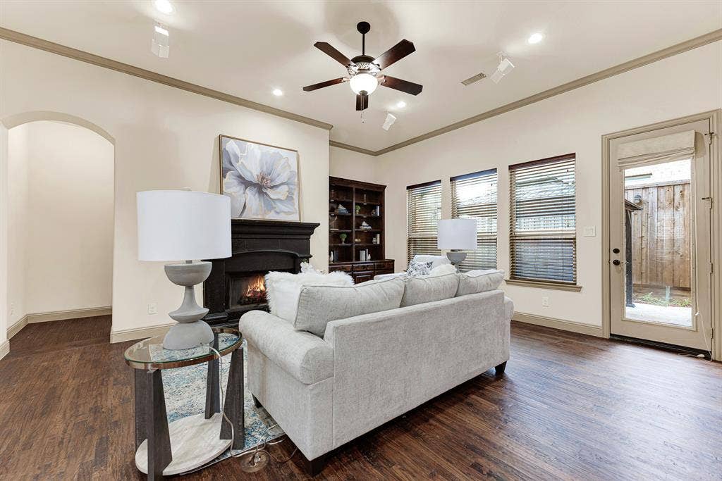 7013 BROOK FOREST Circle, Plano, TX 75024 Recessed art lighting highlights the clean wall profile, while the patio door offers easy outdoor access. It invites relaxed indoor-outdoor living, stepping directly out for fresh air between lively conversations.