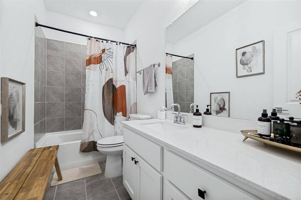 7536 Laburnam Road, Dallas, TX 75228 White vanity with a light-toned countertop and chrome fixtures
